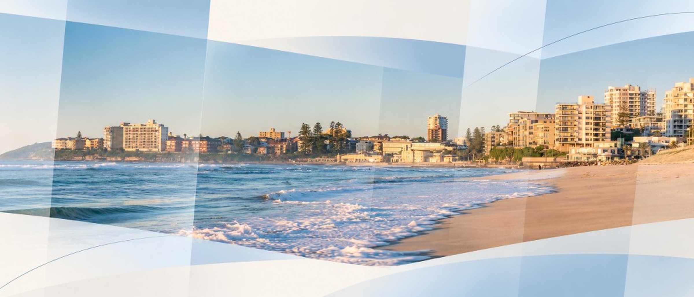 Sandy beach and coastal skyline at golden hour